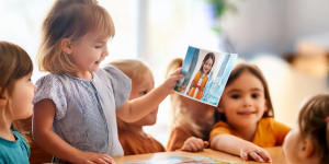 A girl looking at a family photo